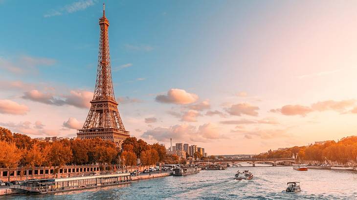 The Eiffel Tower on the banks of the Seine River at sunset