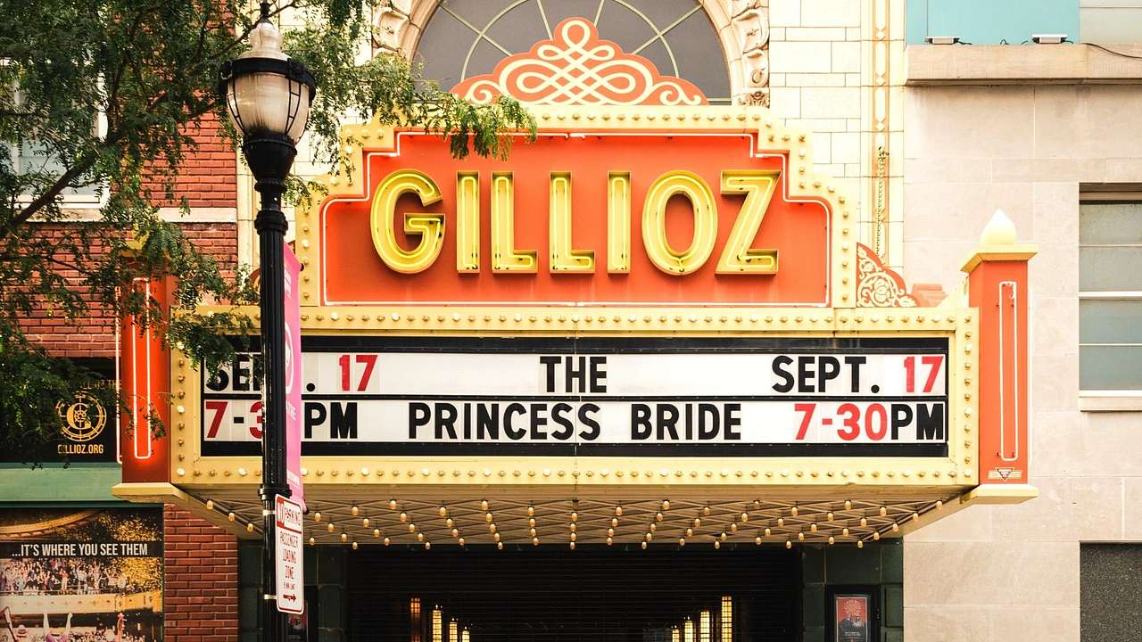 A theater with a red and yellow sign that says "Gillioz"