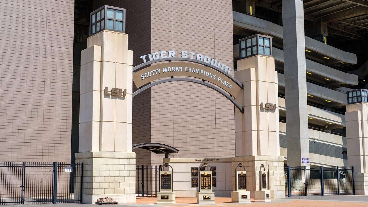 The entrance to a stadium with an arch and a sign that says "Tiger Stadium"