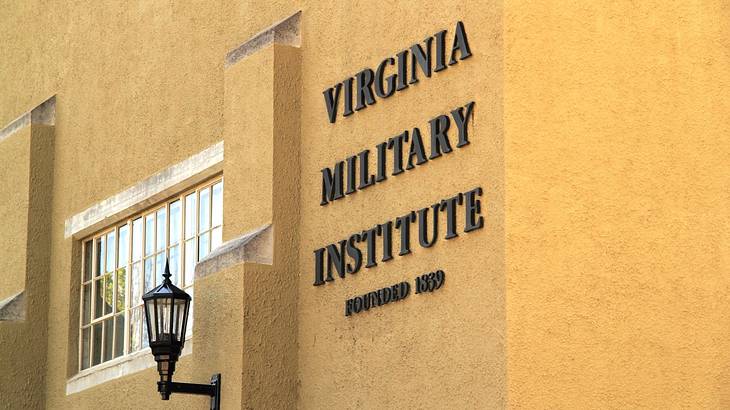 A yellow wall with a "Virginia Military Institute" sign on it