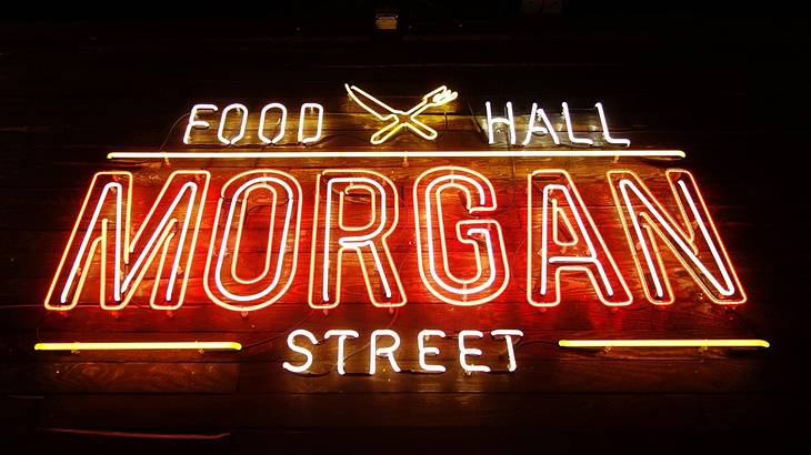 A neon sign that says "Food Hall, Morgan Street"
