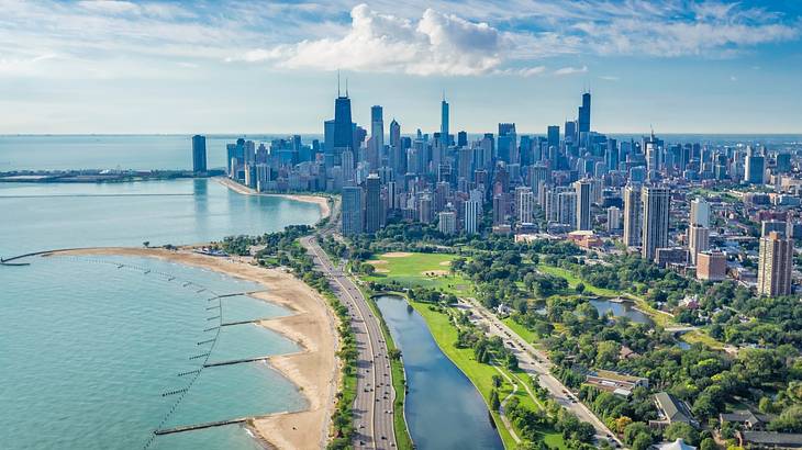 An aerial view of Chicago with water, sand, a park, and skyscrapers An aerial view of Chicago with water, sand, a park, and skyscrapers