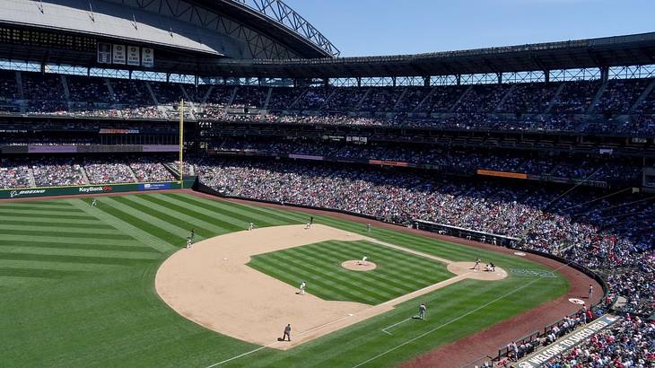 A baseball stadium with a game in play