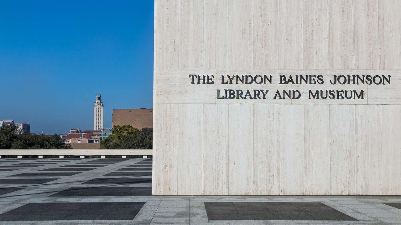 A building that says "The Lyndon Baines Johnson Library and Museum" on it