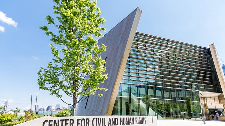 A modern building with a sign that says "Center for Civil and Human Rights"