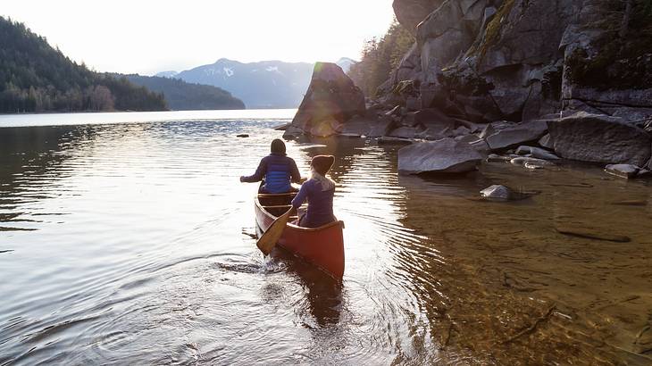 Two people canoeing on water, Harrison Hot Springs, BC, Canada