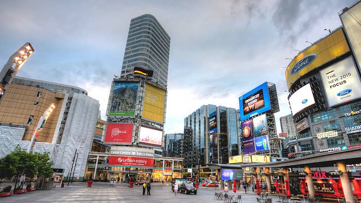 Yonge-Dundas Square surrounded by buildings at night, Toronto, Ontario, Canada Yonge-Dundas Square surrounded by buildings at night, Toronto, Ontario, Canada