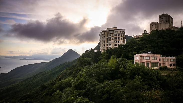 A few buildings on a green peak, Hong Kong