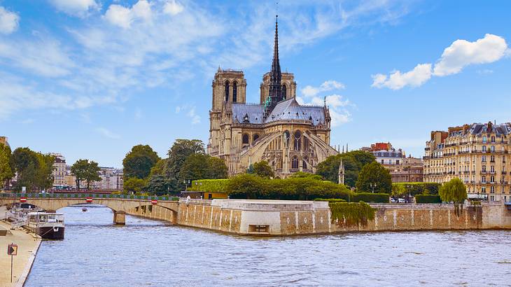 A view of a cathedral from across a river in Paris, France