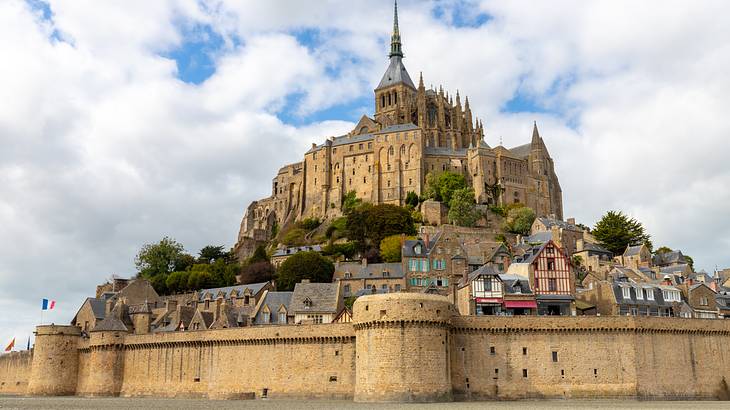 Mont-Saint-Michel Village and Abbey from the beach, France
