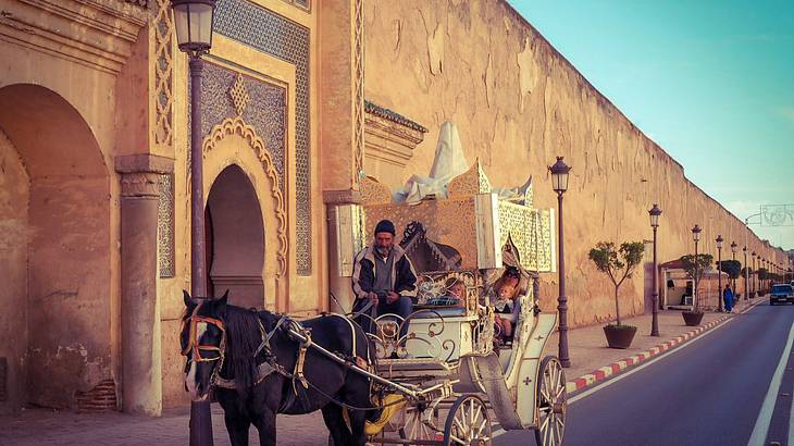 Horse and carriage outside the palace walls in Meknes, Morocco