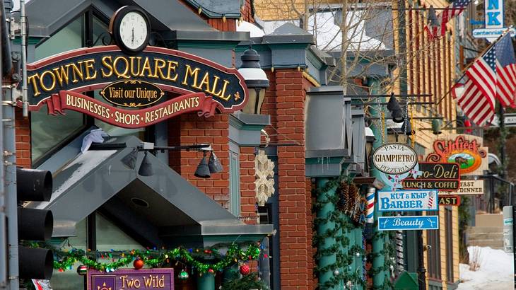 Up-close shot of several shops and establishments lined up along a street Up-close shot of several shops and establishments lined up along a street