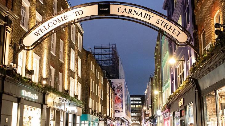 London bucket list - Welcome sign at an entrance to Carnaby Street, in the evening