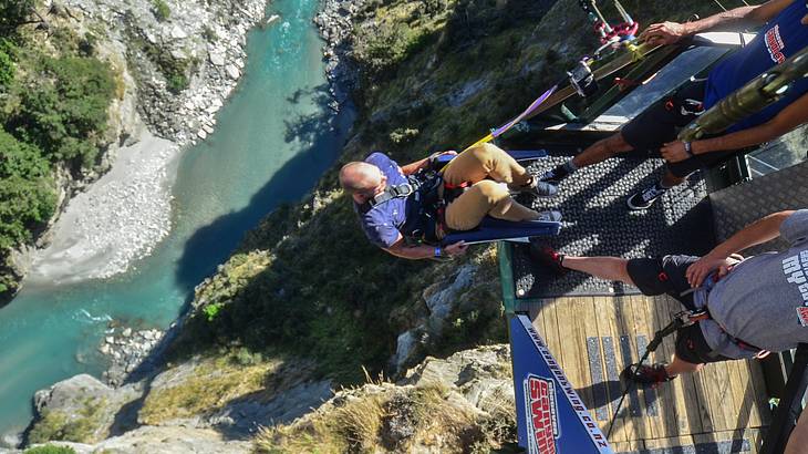 Man taking part in the Shotover Canyon Swing in Queenstown, NZ