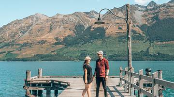 Man and woman holding hands on the Glenorchy Jetty, NZ