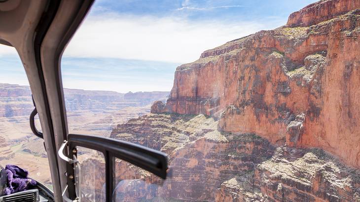 A view of a canyon from a helicopter window