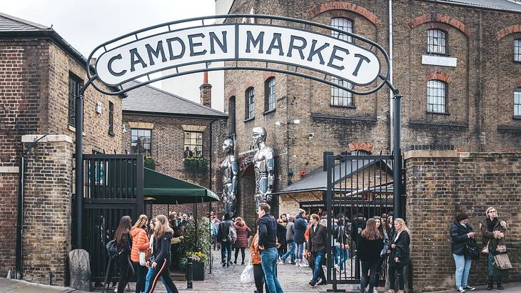 A brick building and a sign that says "Camden Market"