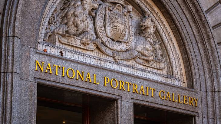 A stone entryway with a sign that says "National Portrait Gallery"
