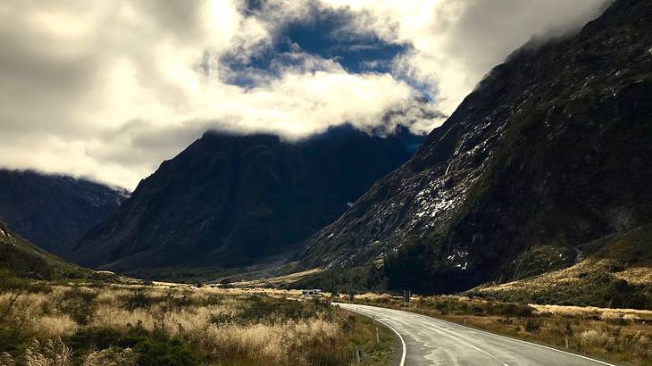 Road going through the mountains and Eglinton Valley, New Zealand