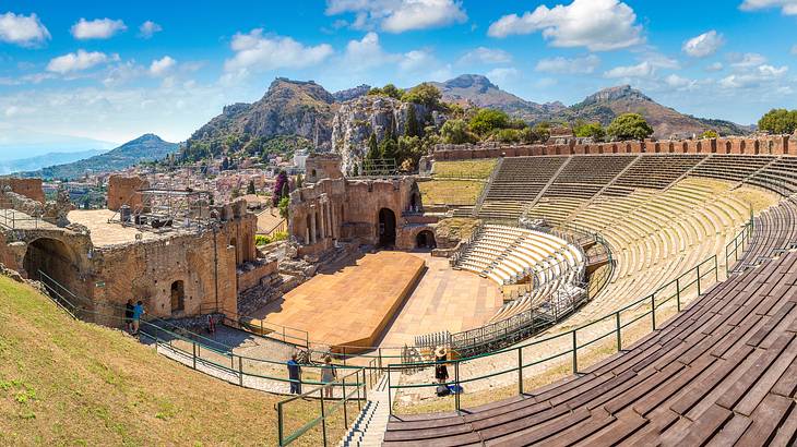 A panorama of an ancient Greek theatre overlooking the Mediterranean Sea