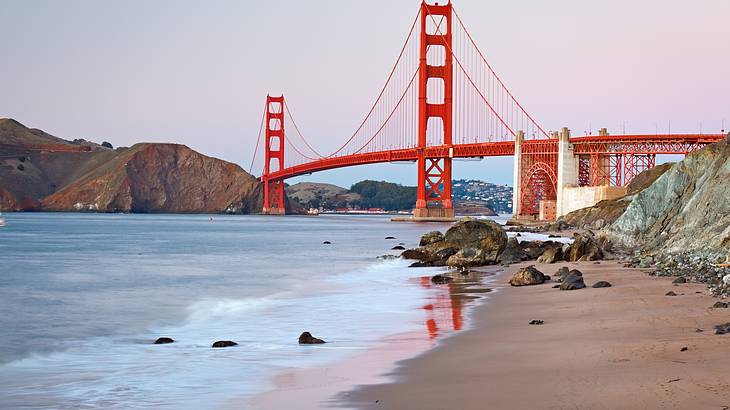 The red Golden Gate Bridge is one of the famous San Francisco landmarks The red Golden Gate Bridge is one of the famous San Francisco landmarks