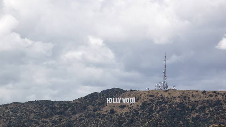 The white "Hollywood" sign on a hill