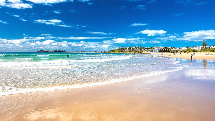 Waves lapping the shore of a beach in Australia