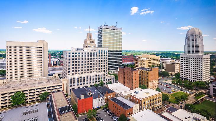 A city with many buildings under a blue sky A city with many buildings under a blue sky