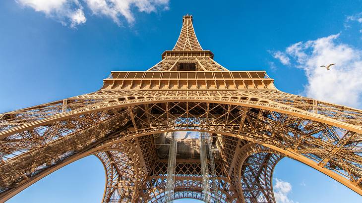 View of the Eiffel Tower against a blue sky, a must for your Paris bucket list