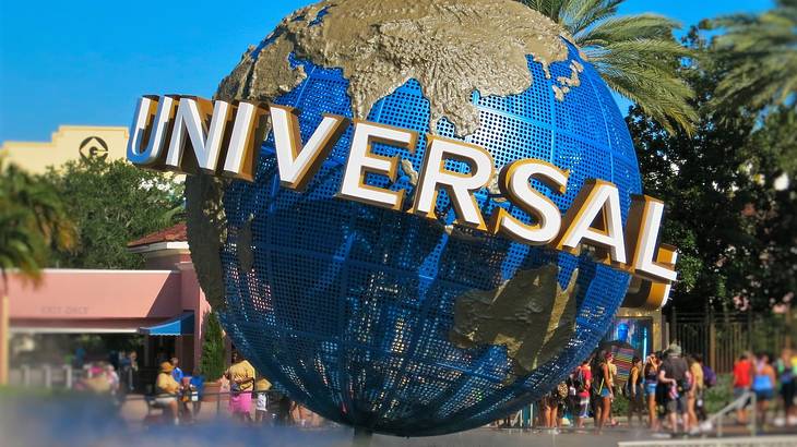 Universal in capital letters around a massive globe with people around