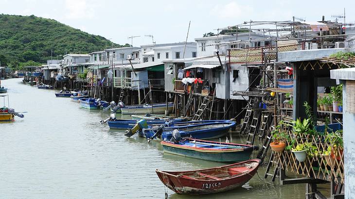 Stilt houses on water with boats, Lantau Island, Hong Kong