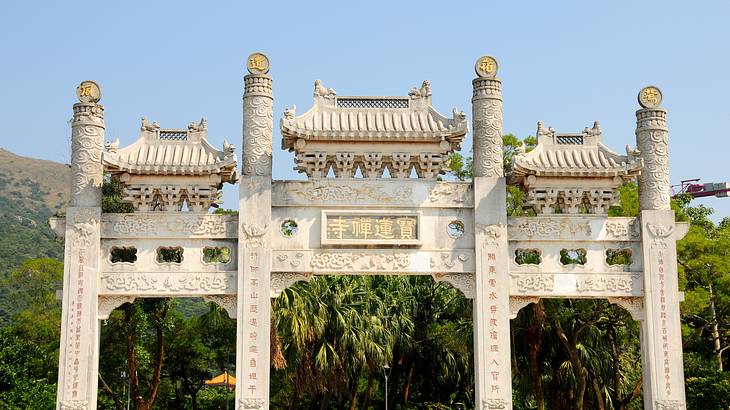 White entrance gate of a monastery, Lantau Island, Hong Kong