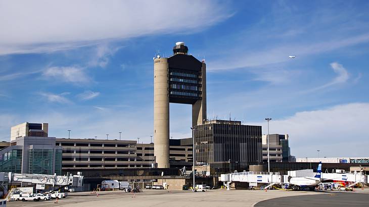 Large airport buildings with a tower with tarmac in the foreground