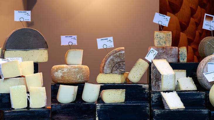 Variety of cheeses on display at Borough Market in London, UK