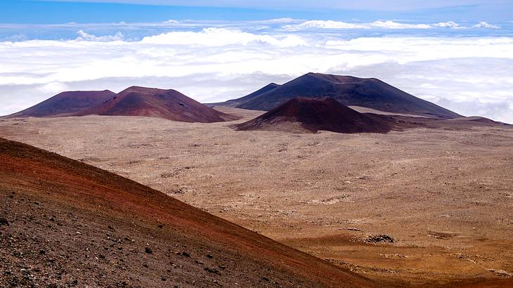 Craters at Mauna Kea volcano, one of the most famous landmarks in Hawaii Craters at Mauna Kea volcano, one of the most famous landmarks in Hawaii