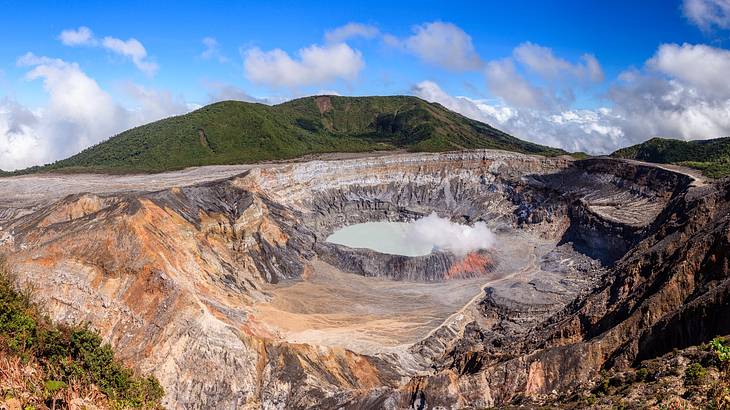Top view of a crater of an active volcano on a sunny day