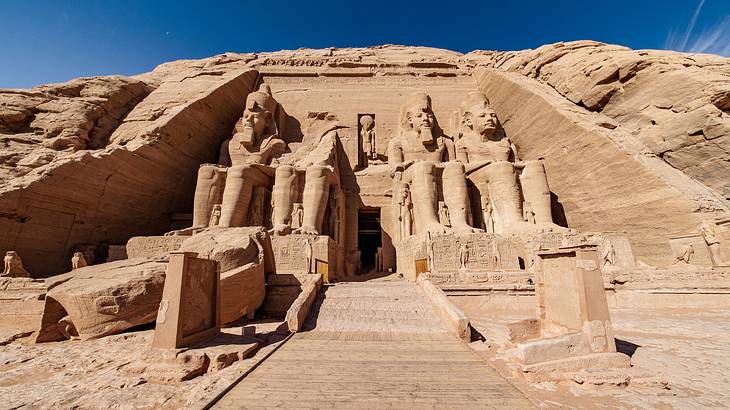 Pharaohs carved on the Abu Simbel Temples' entrance, a famous landmark in Egypt