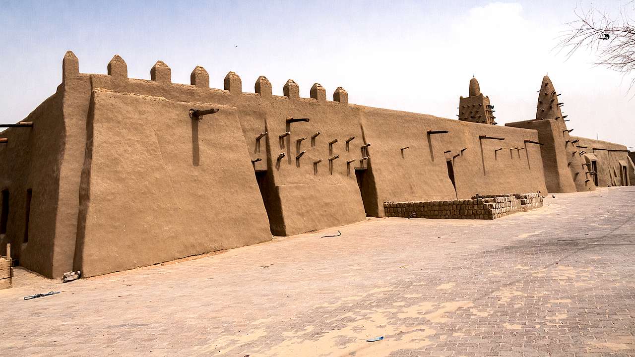 An interestingly-shaped sand-colored mosque with spikes