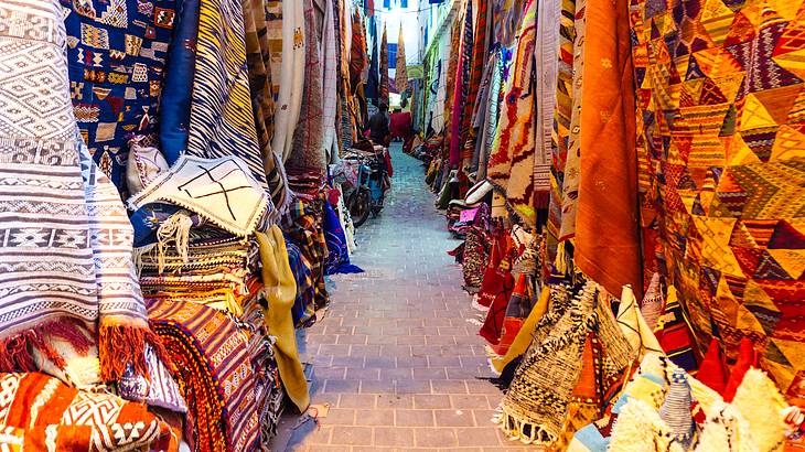 An alley lined with many colorful cloths