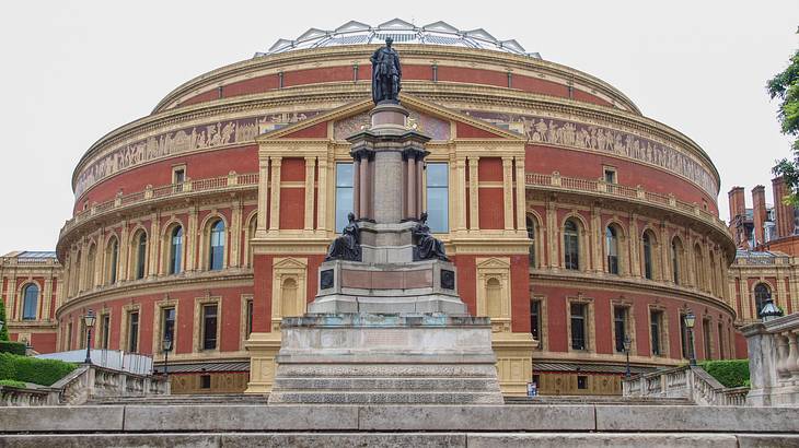 Picture of a concert hall with a statue in front, London, UK