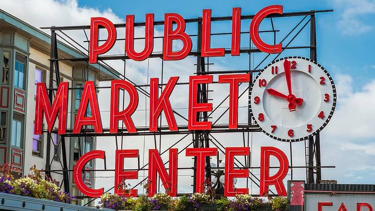 A red sign that says "Public Market Center" with a clock next to it