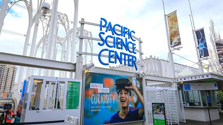 The entrance to a museum with a "Pacific Science Center" sign