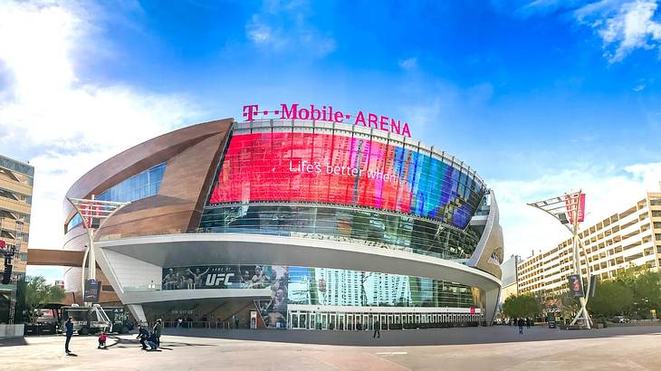 A modern arena with a "T-Mobile Arena" sign