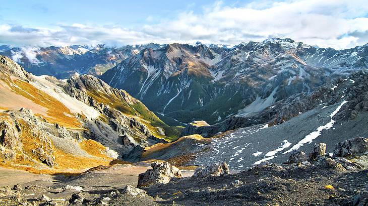 Looking over many snow-capped mountain peaks