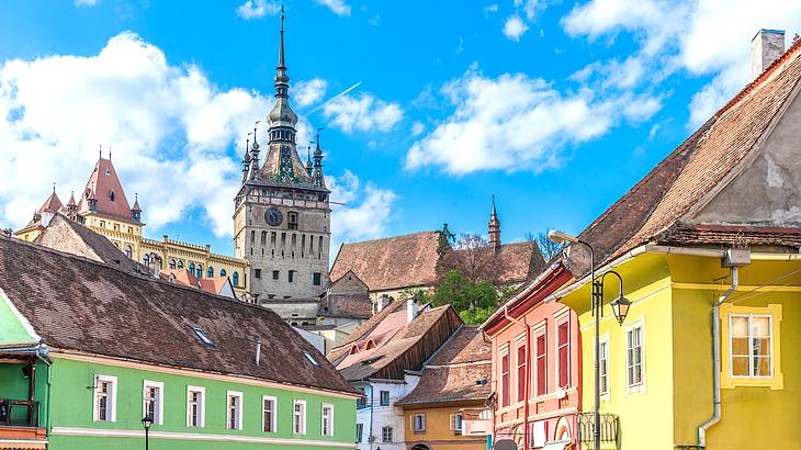 Skyline view of green hills and rooftops in a city in Romania