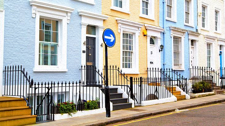 Light pastel-colored house facades on a street, London, UK