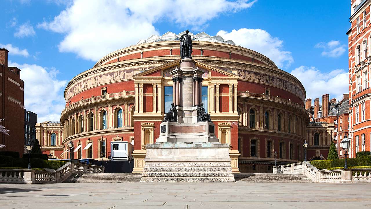Picture of a concert hall with a statue in front, London, UK