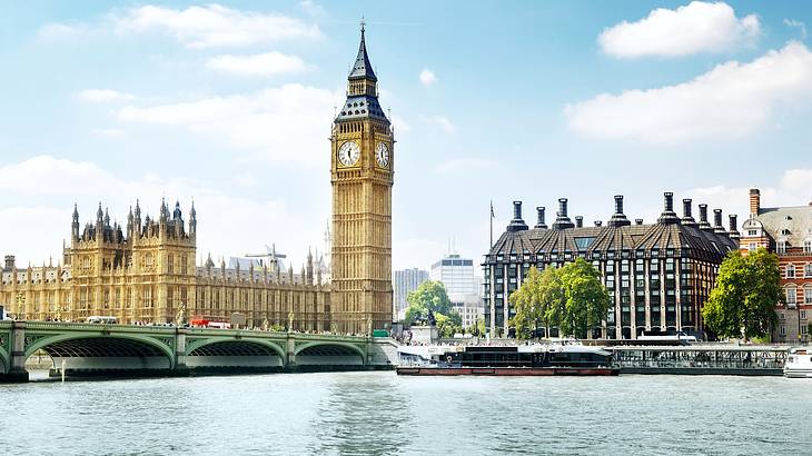 Big Ben, Houses of Parliament, and a bridge from across the canal, London, UK