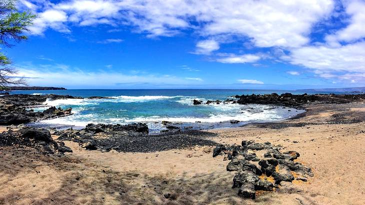 A rocky beach with blue water in Maui, Hawaii, USA