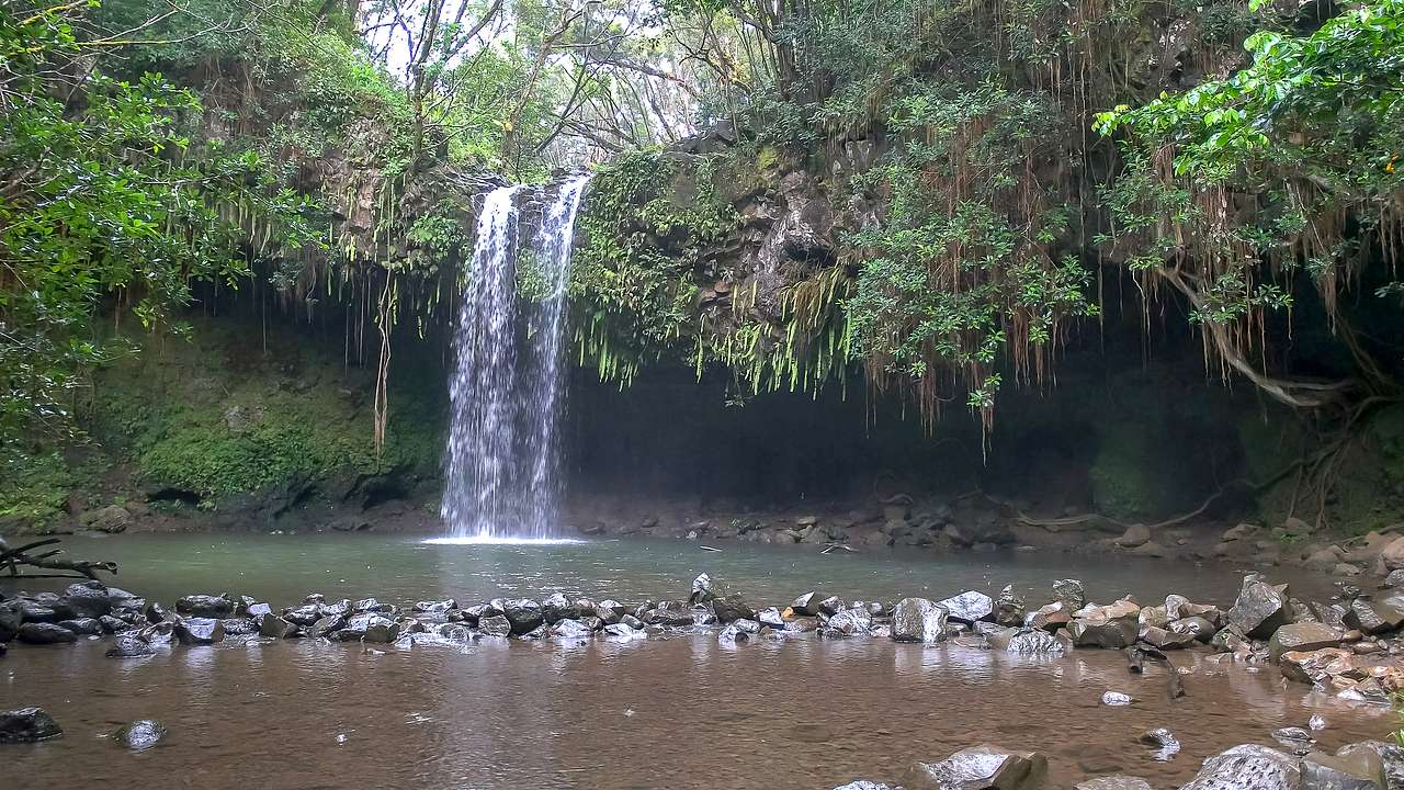 A waterfall going off an edge, Twin Falls, Maui, Hawaii, USA
